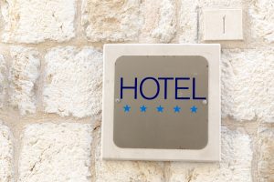 Closeup shot of five star hotel sign on old town wall